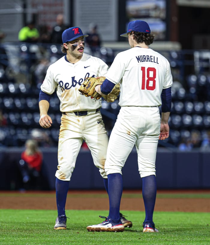Ole Miss third baseman Andrew Fischer and relief pitcher Mitch Murrell on Friday night at Swayze Field.